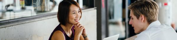 Asian lady and young man in coffee shop