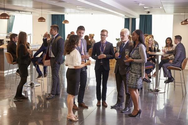 Group of people talking and networking