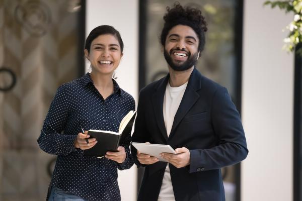 Two happy young professionals