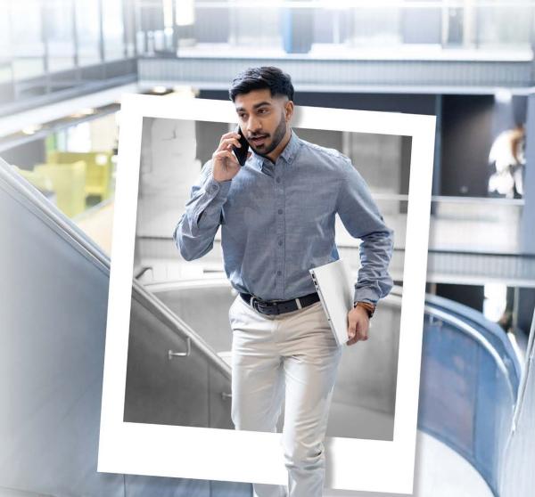Young man walking up stairs out of a black and white polaroid into colour