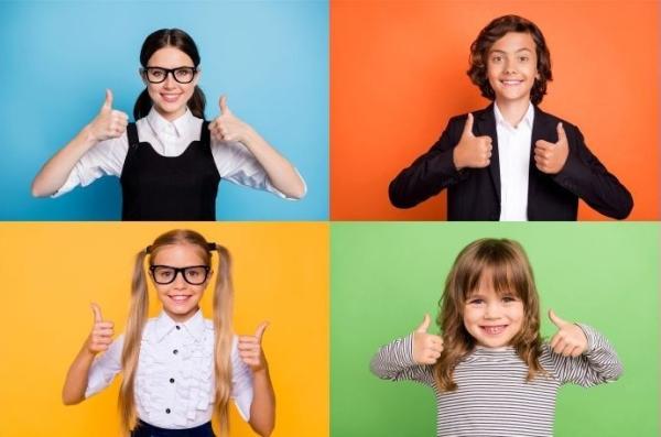 Collage of children all holding their thumbs up