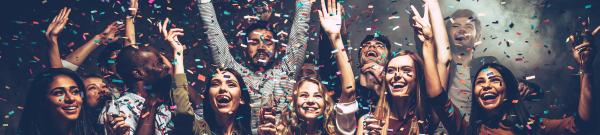 A group of people celebrating with confetti