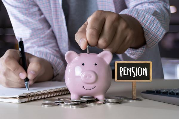 Pink piggy bank with 'pension' written next to it