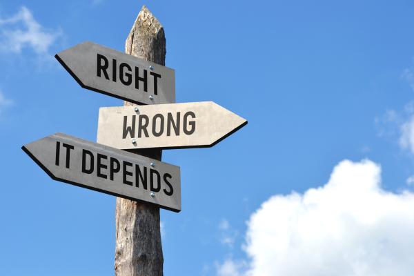 Signpost with directions reading "right", "wrong" and "it depends"