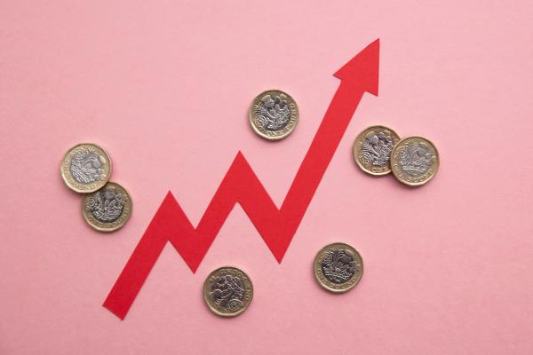 Red arrow rising in stages between pound coins