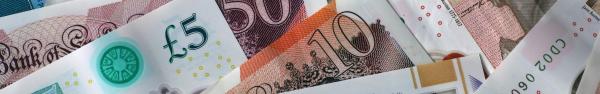 Bank of England notes spread out of different denominations