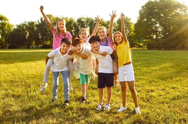Image shows a group of children playing outside