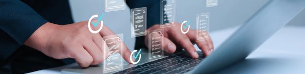 Hands using a laptop with virtual images projected above showing pages and ticks or checkmarks 