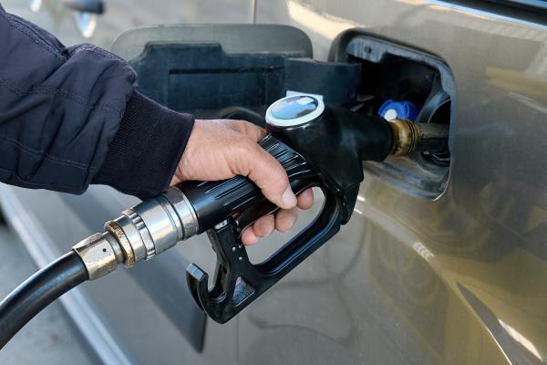 Man filling up petrol tank of car