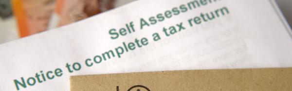 Notice to file tax return showing above brown envelope with HMRC logo