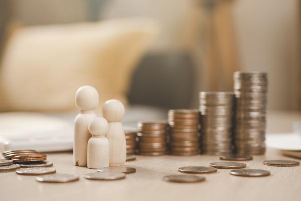 Picture showing family members and stack of coins