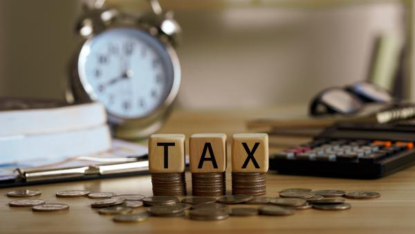 Image of tax written in wooden letters 