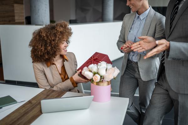 Employee receiving a gift of flowers